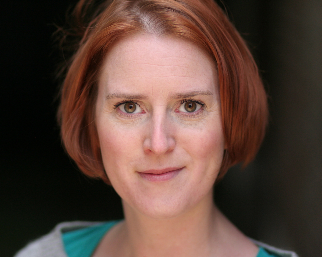 Red haired actress with green eyes