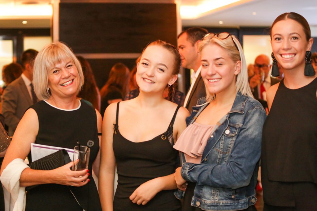 Four ladies at a corporate event