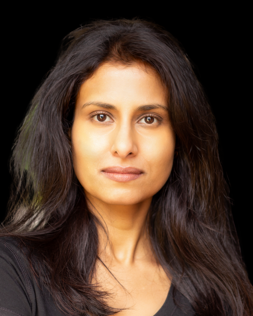 Asian actress wearing brown top